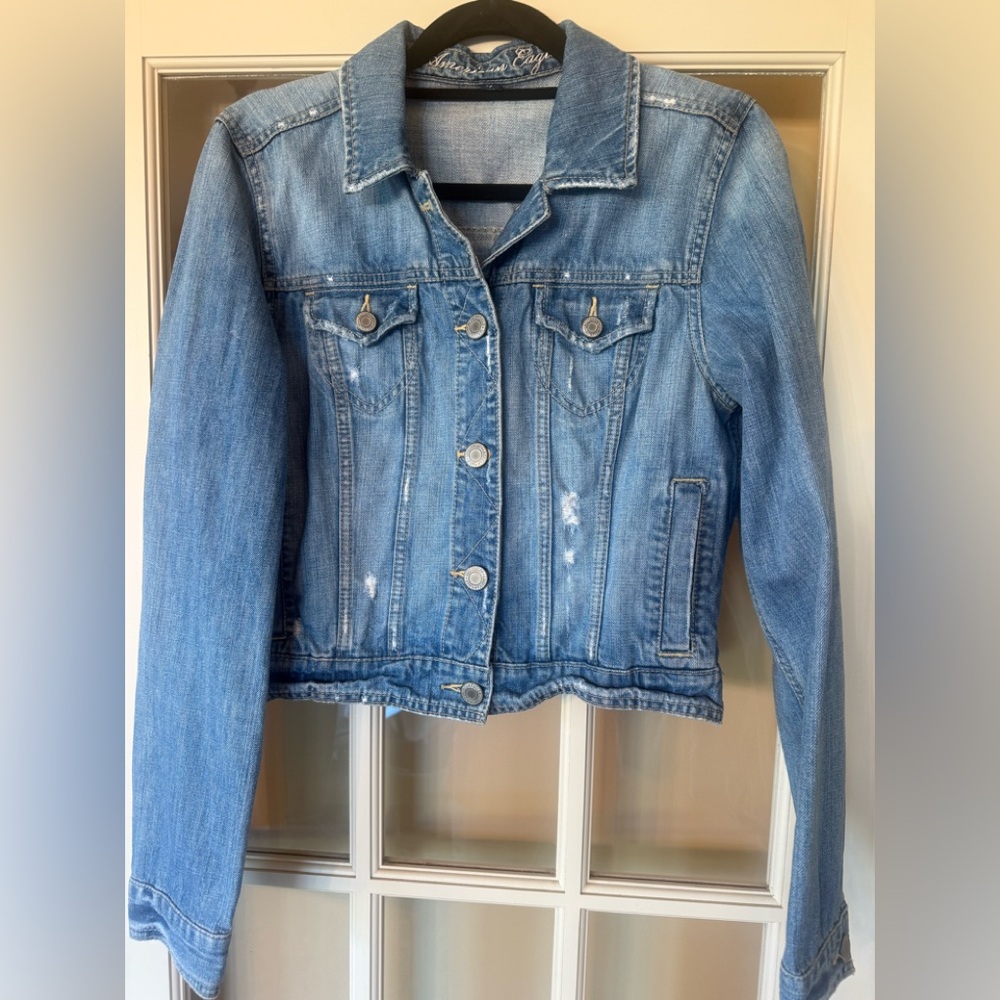 American Eagle Light Blue Distressed Denim Jacket size Large onesie